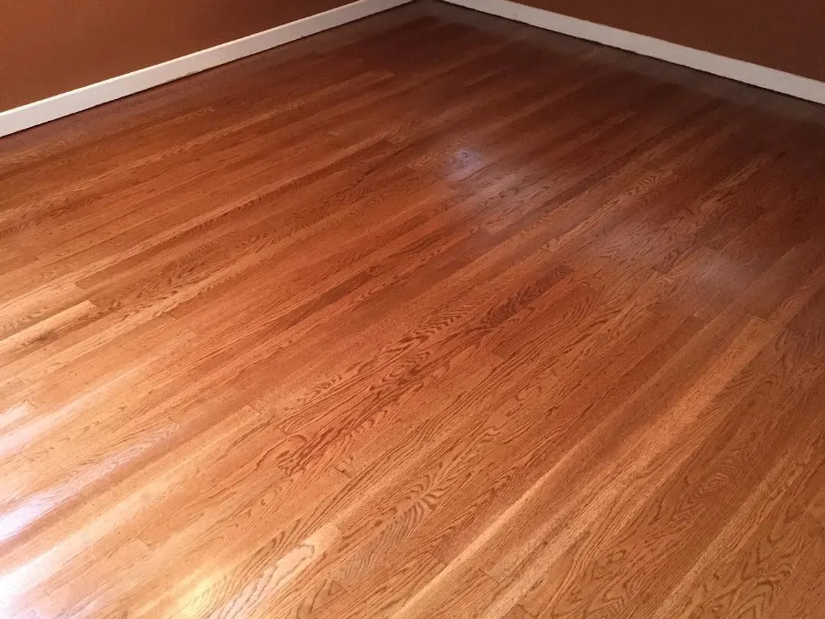 The same bedroom with the hardwood floor refinished
