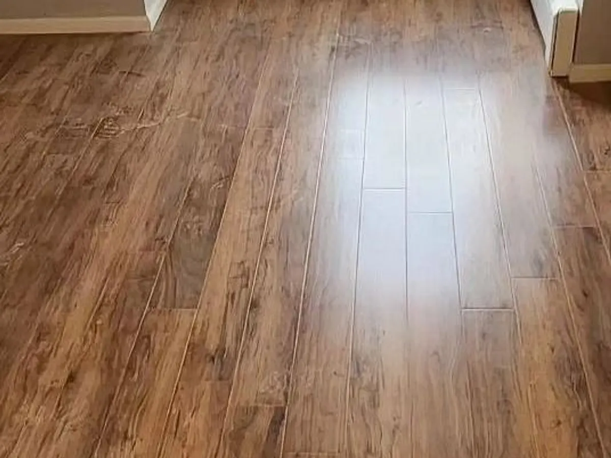 The same hardwood floor sanded and refinished