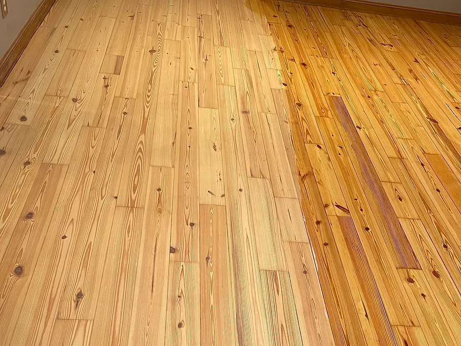 Long hallway with a natural hardwood finish